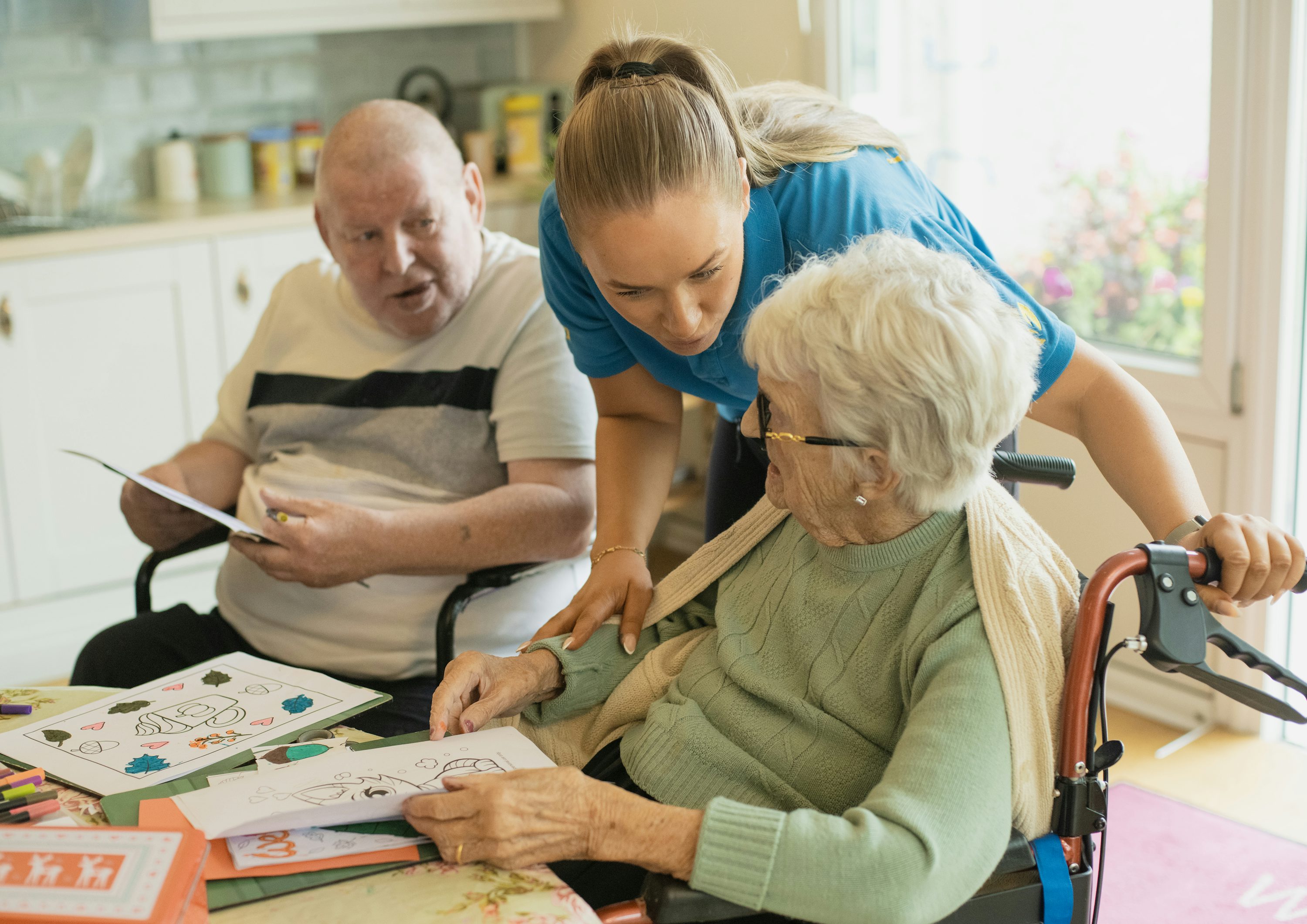 A caregiver and older adult sharing an everyday moment at home