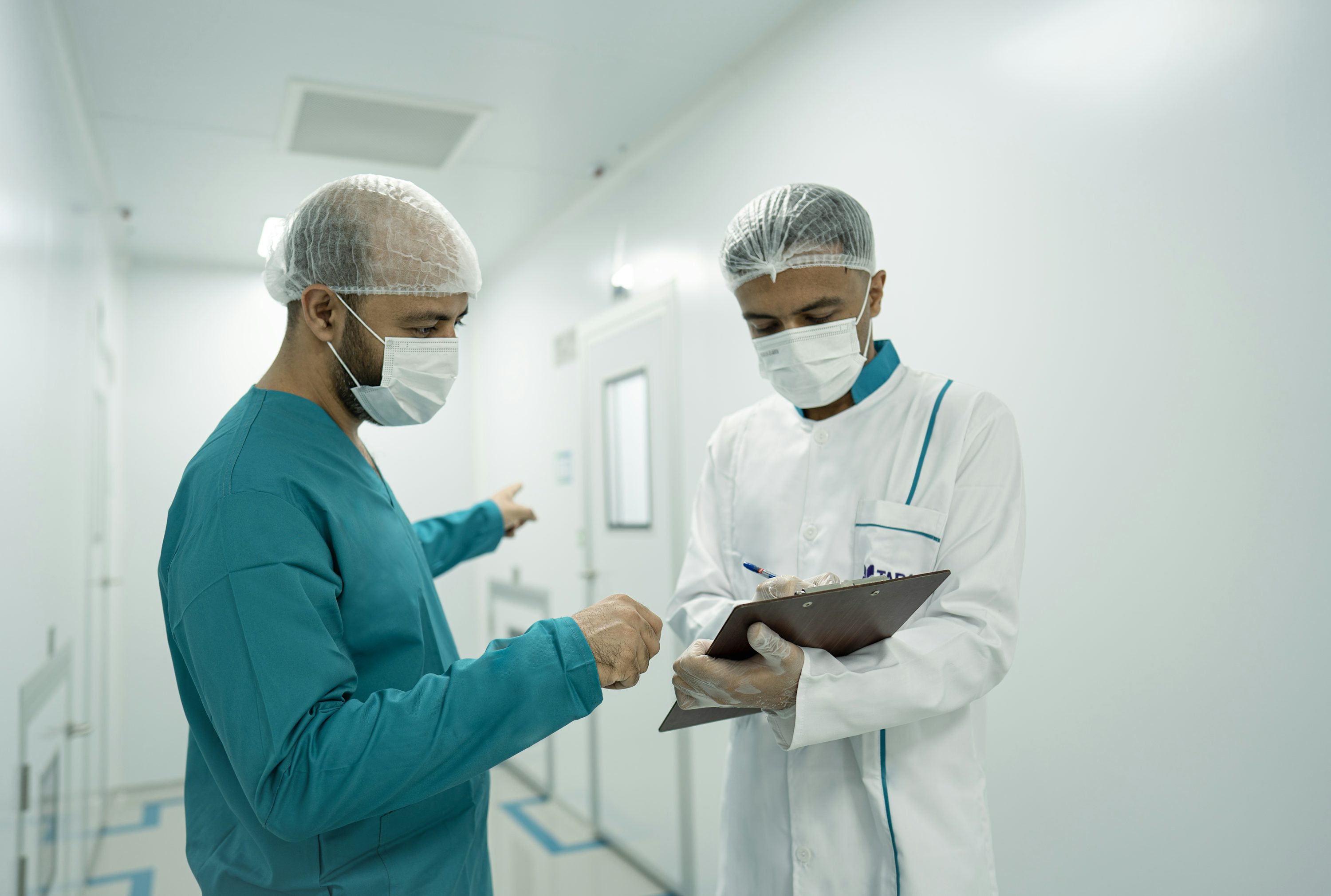 Healthcare professionals coordinating staffing at a hospital workstation